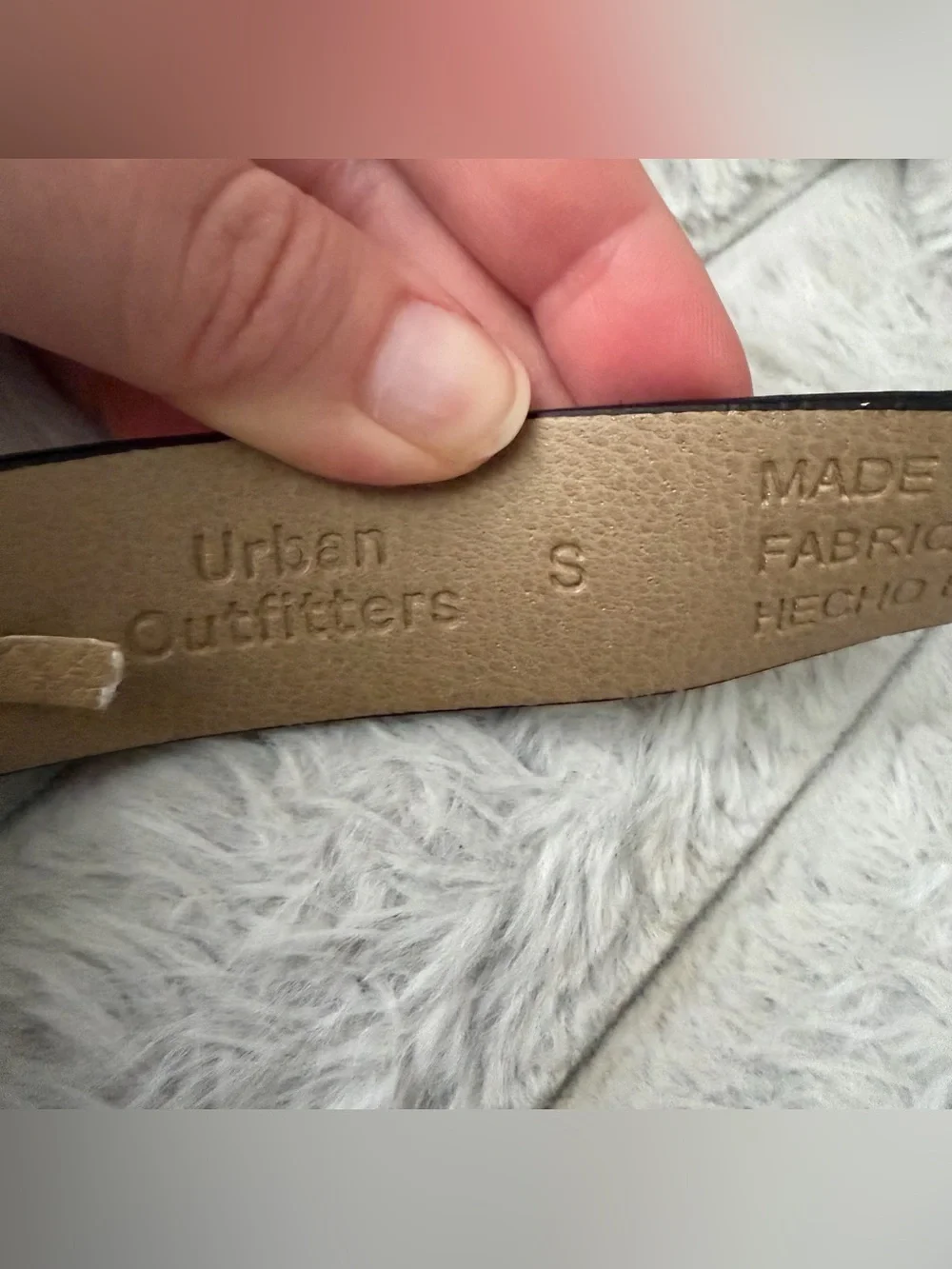 Urban Outfitters leather cow print calf hair belt.